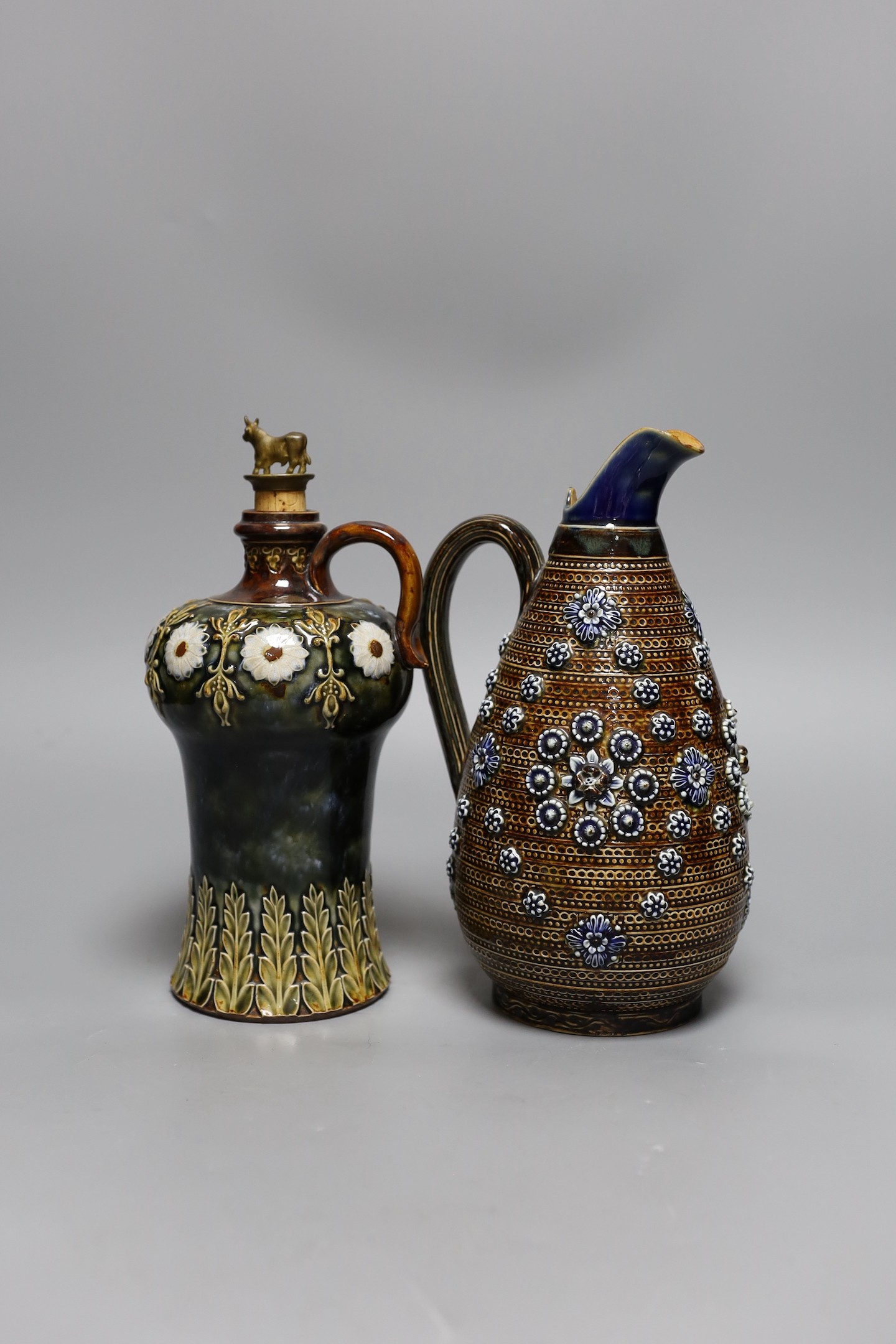 A Doulton Lambeth stoneware decanter and a similar jug, dated 1877, jug 24cms high